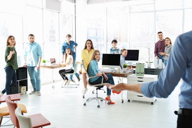 Photo of Young people having business training in office