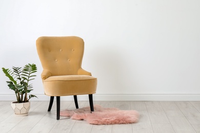 Photo of Elegant room interior with stylish comfortable armchair