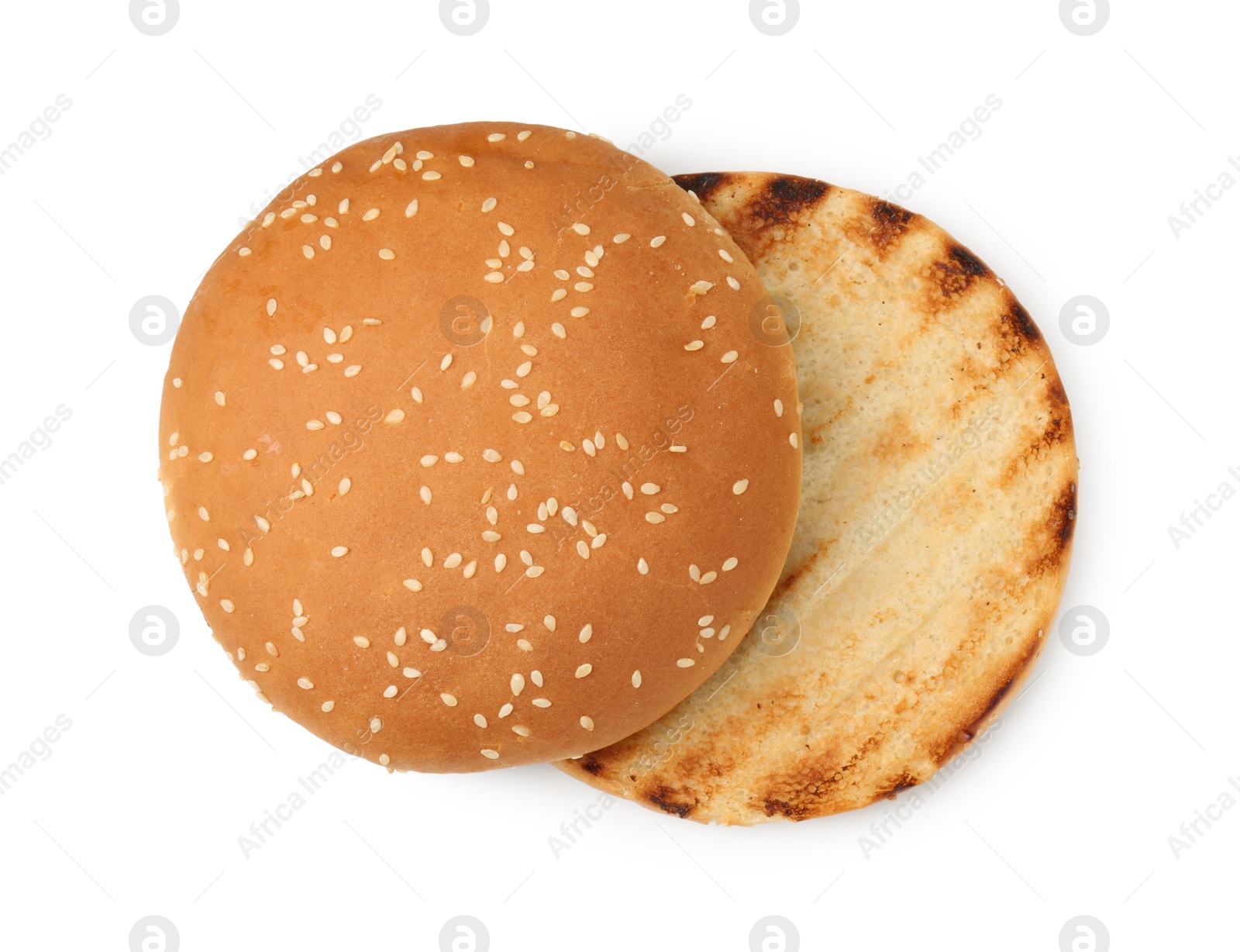 Photo of Halves of grilled burger bun isolated on white, top view