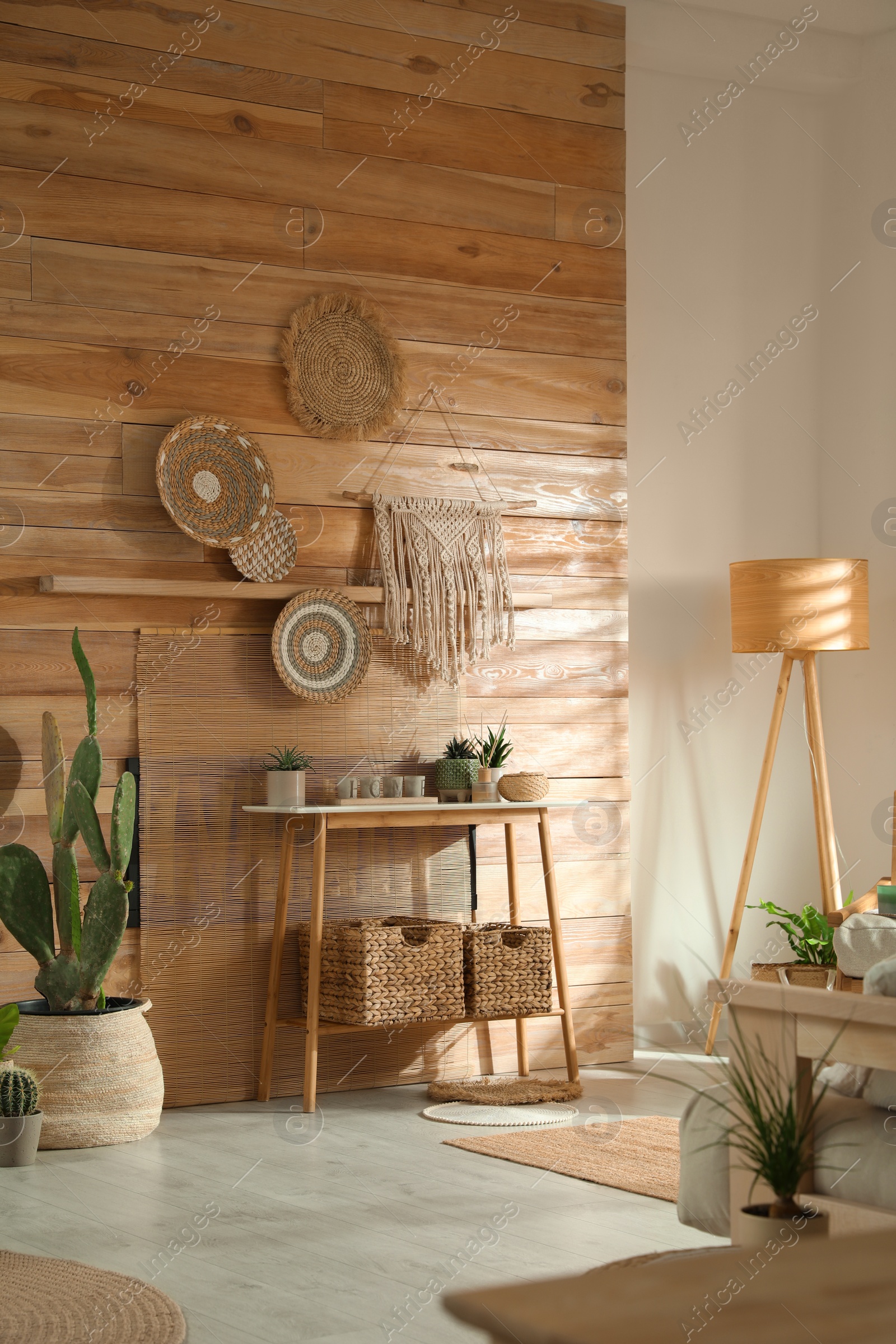 Photo of Stylish living room interior with wooden furniture and beautiful houseplants