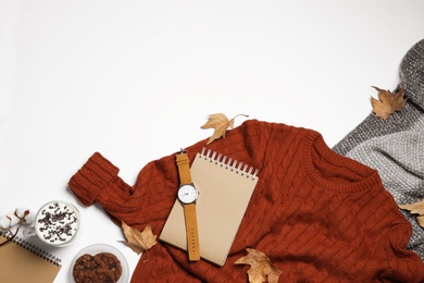 Photo of Flat lay composition with soft knitted sweater on white background