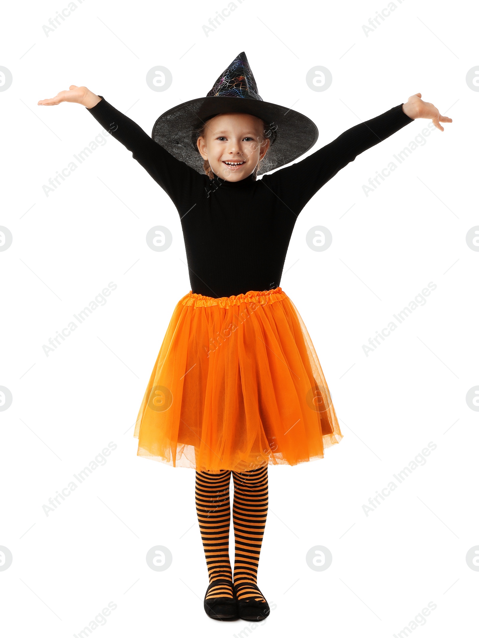 Photo of Cute little girl wearing Halloween costume on white background