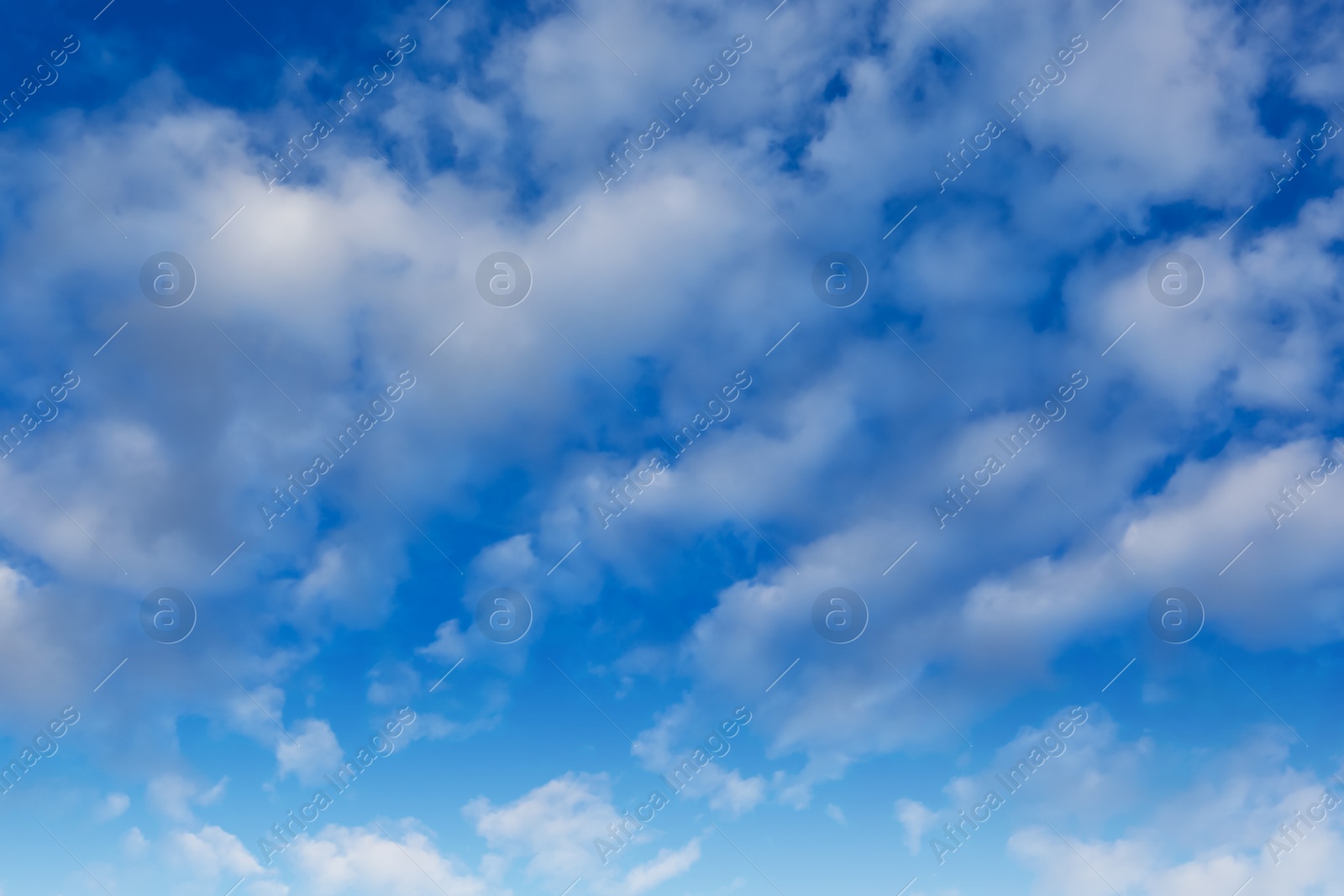 Photo of Picturesque view of beautiful fluffy clouds in light blue sky