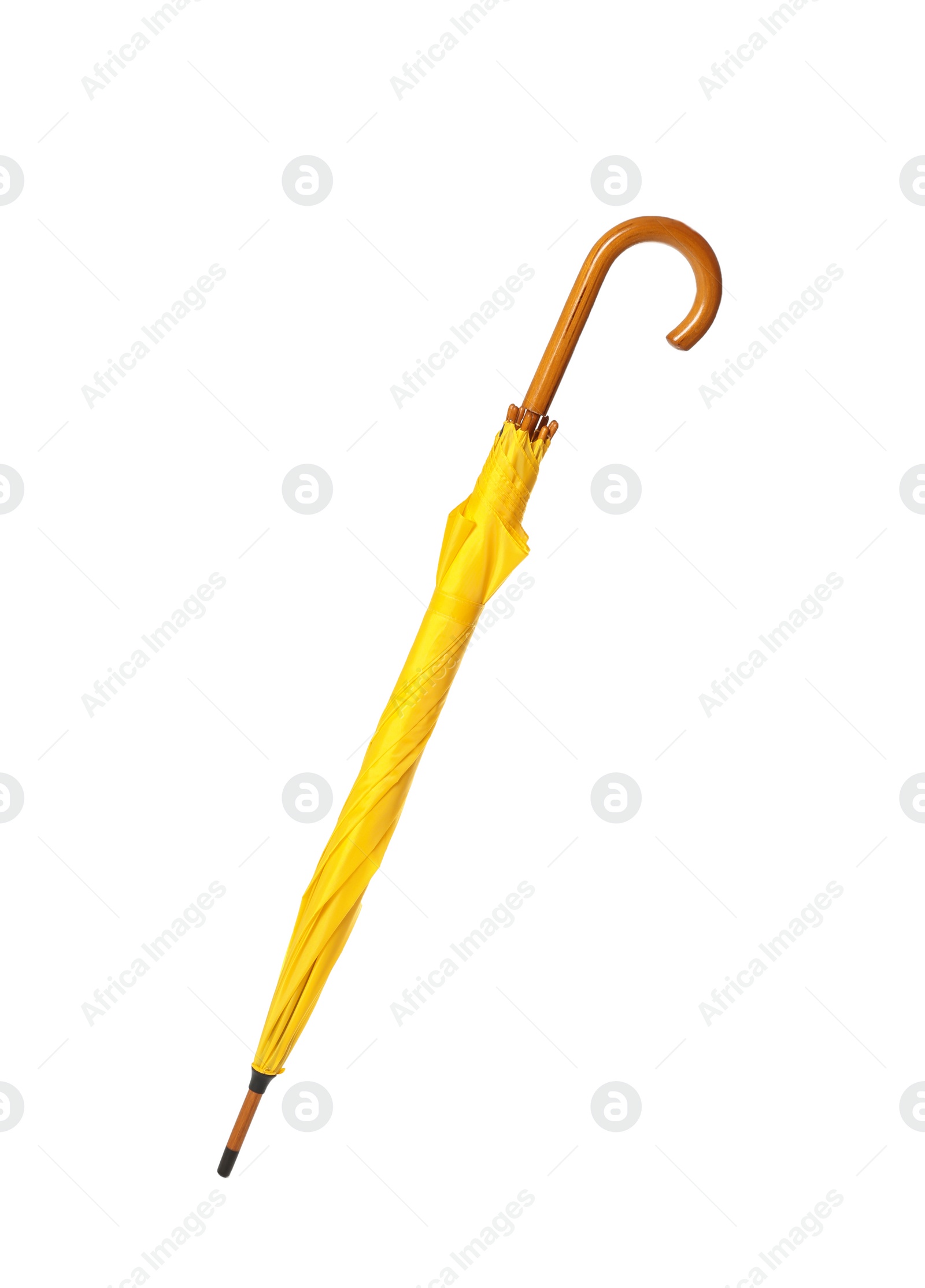 Photo of Modern closed yellow umbrella isolated on white