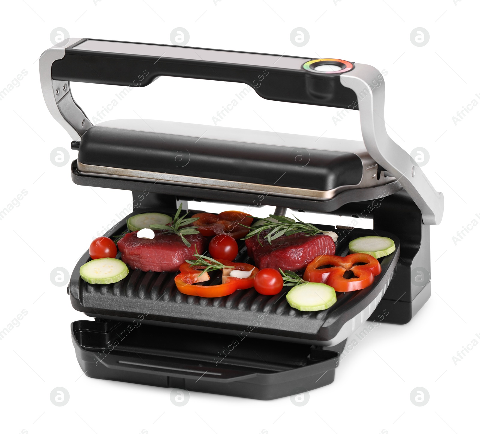 Photo of Electric grill with raw meat, rosemary and vegetables isolated on white