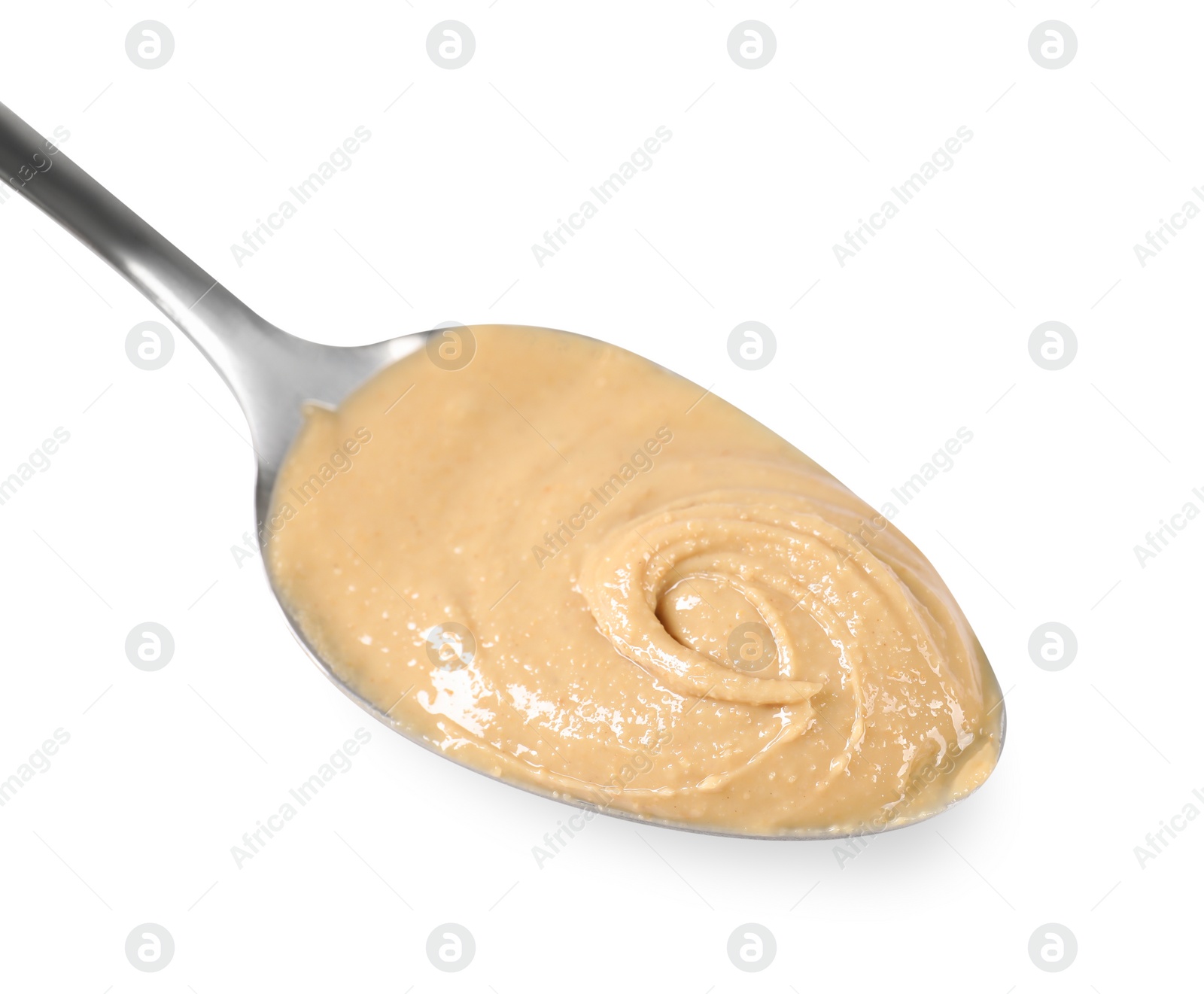 Photo of Delicious nut butter in spoon isolated on white