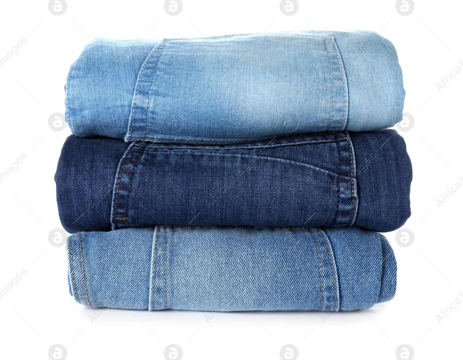 Photo of Stack of different jeans isolated on white