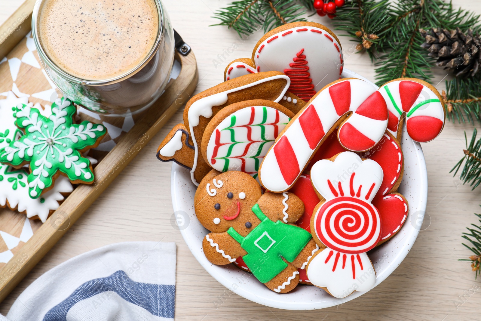 Photo of Delicious Christmas cookies on wooden table, flat lay