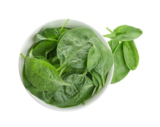 Photo of Fresh green healthy baby spinach leaves in ceramic bowl isolated on white, top view