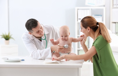 Photo of Woman with her baby visiting children's doctor in hospital