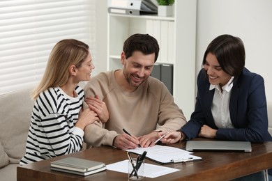Photo of Professional notary working with couple in office