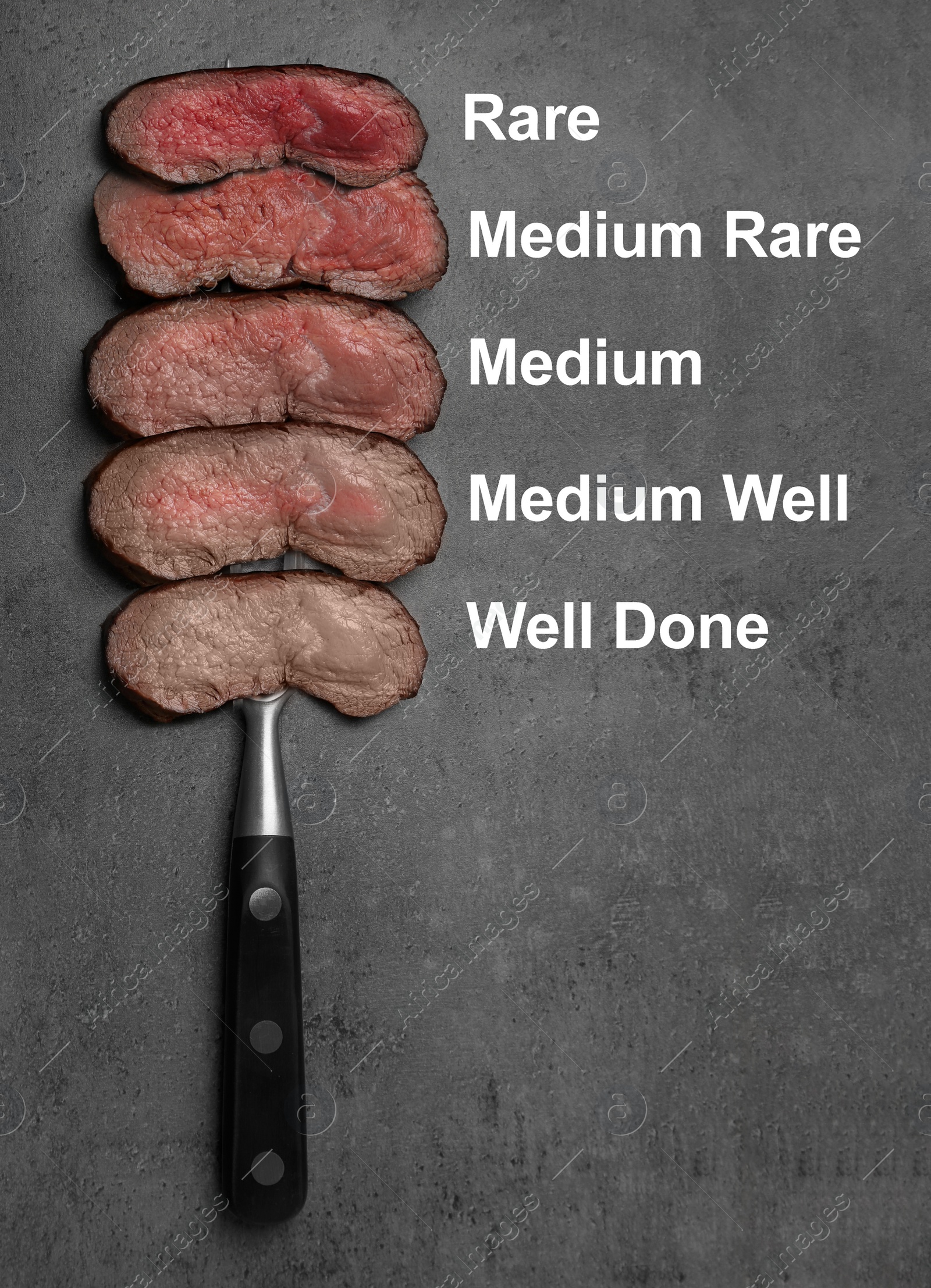 Image of Delicious sliced beef tenderloins with different degrees of doneness on grey background, top view 