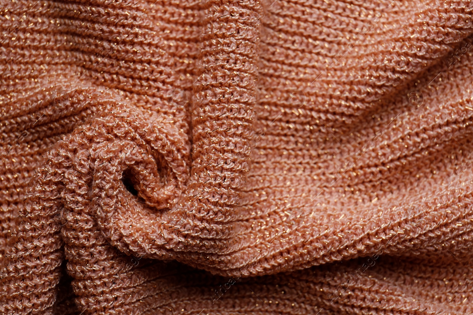 Photo of Brown knitted fabric as background, top view