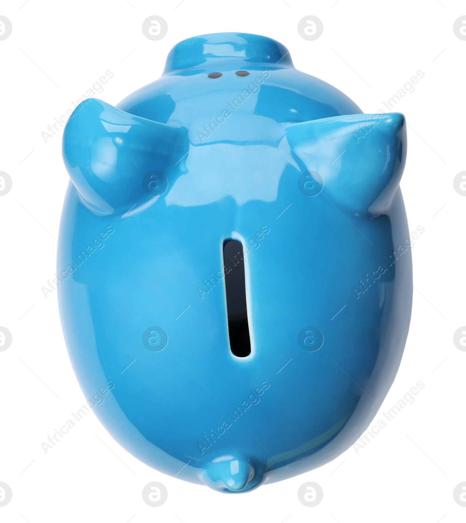 Photo of Blue piggy bank on white background, top view. Money saving