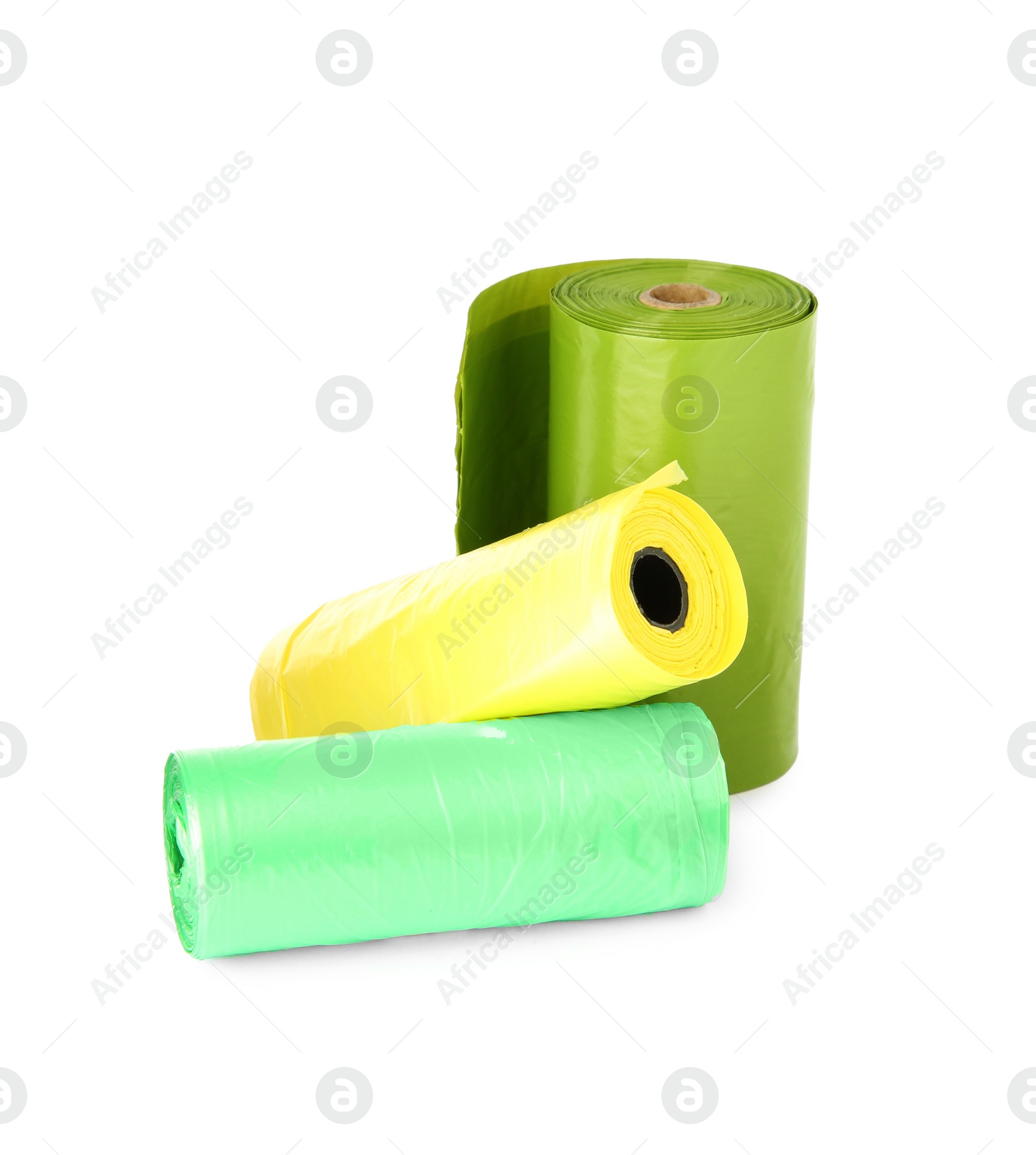 Photo of Colorful dog waste bags on white background