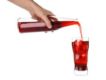 Photo of Woman pouring grape soda water into glass on white background, closeup. Refreshing drink