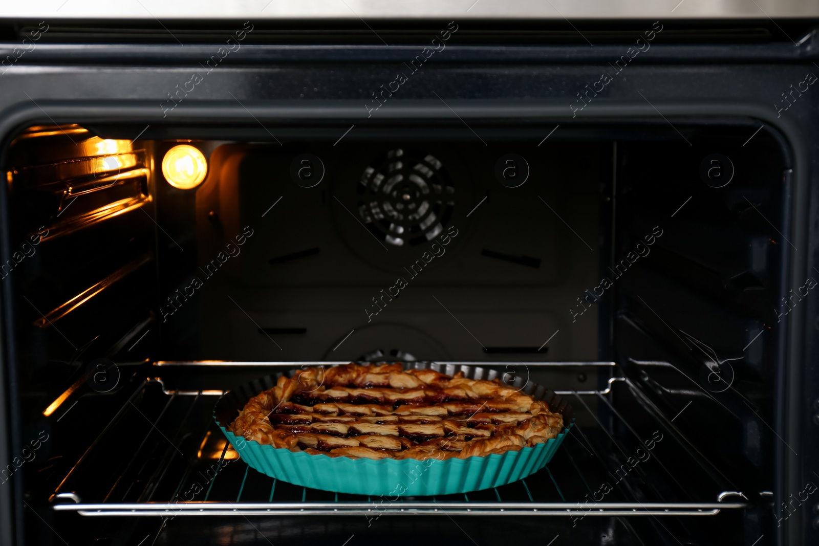 Photo of Delicious fresh homemade cake in modern oven