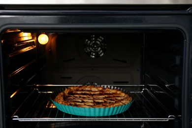 Delicious fresh homemade cake in modern oven