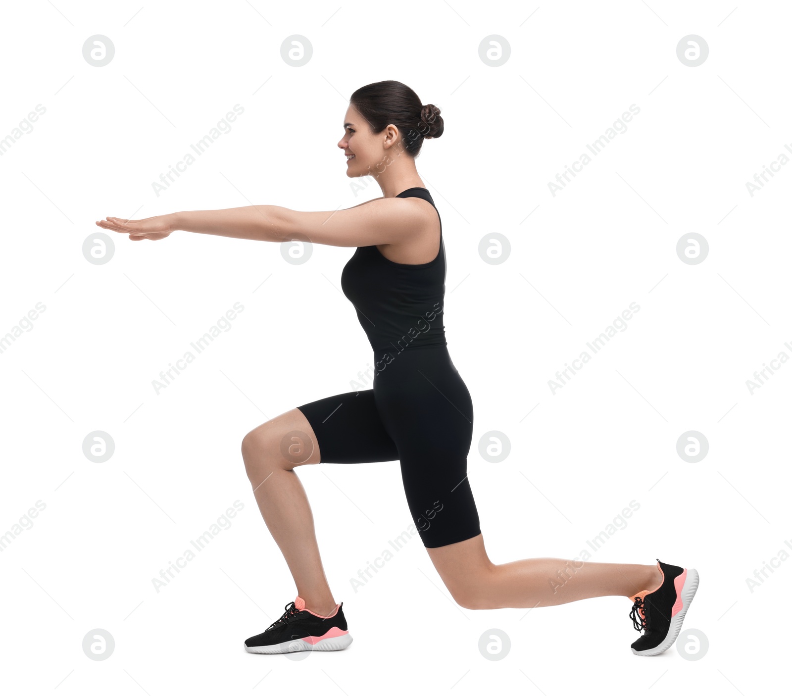 Photo of Happy woman doing morning exercise on white background