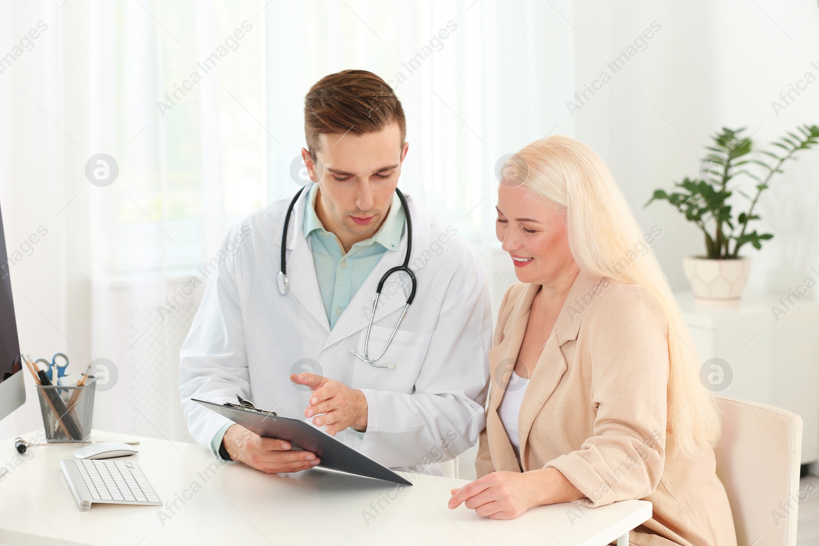 Photo of Doctor working with mature patient in hospital