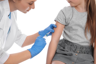 Photo of Little girl receiving chickenpox vaccination on white background. Varicella virus prevention