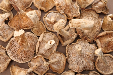 Delicious dried mushrooms on table, top view