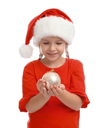 Photo of Cute little child wearing Santa hat with Christmas decoration on white background