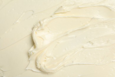 Photo of Texture of tasty butter as background, top view