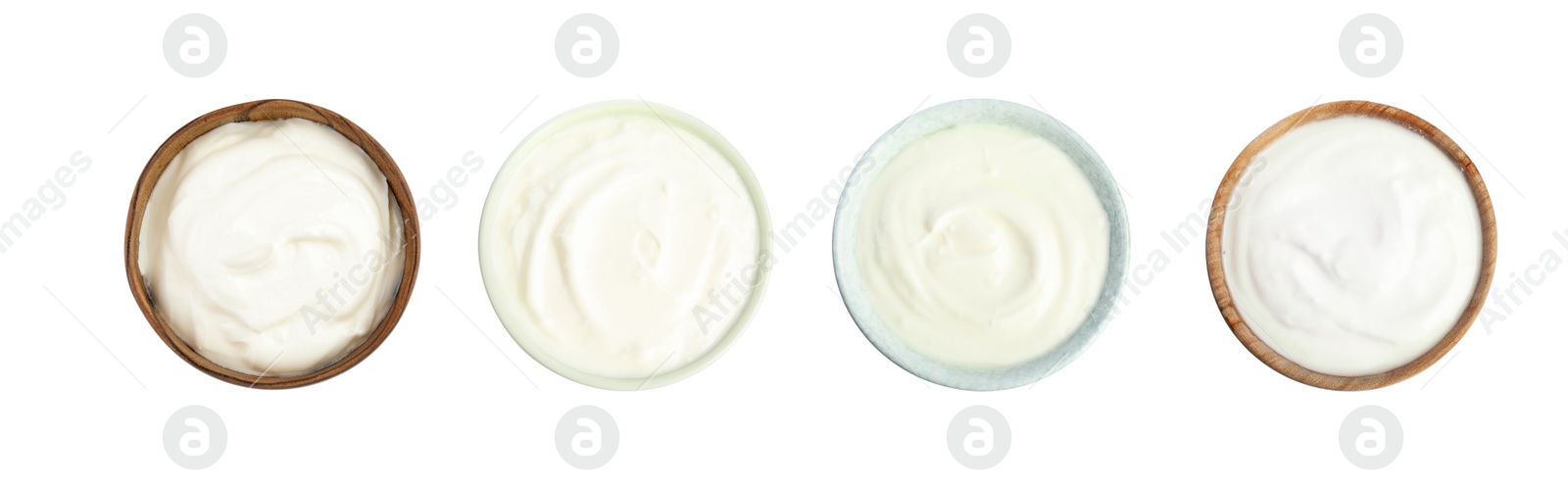 Image of Set of delicious natural yogurt in bowls on white background, top view. Banner design