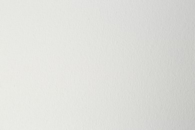 Photo of Blank white canvas as background, closeup view