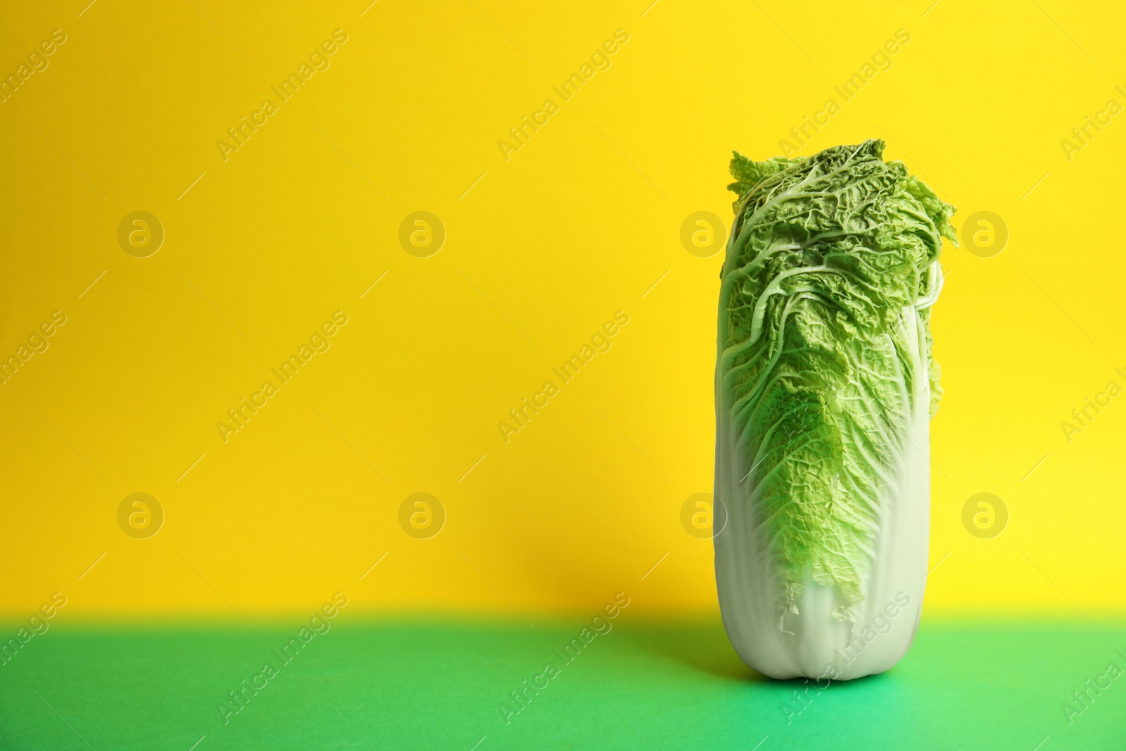 Photo of Fresh ripe cabbage on color background