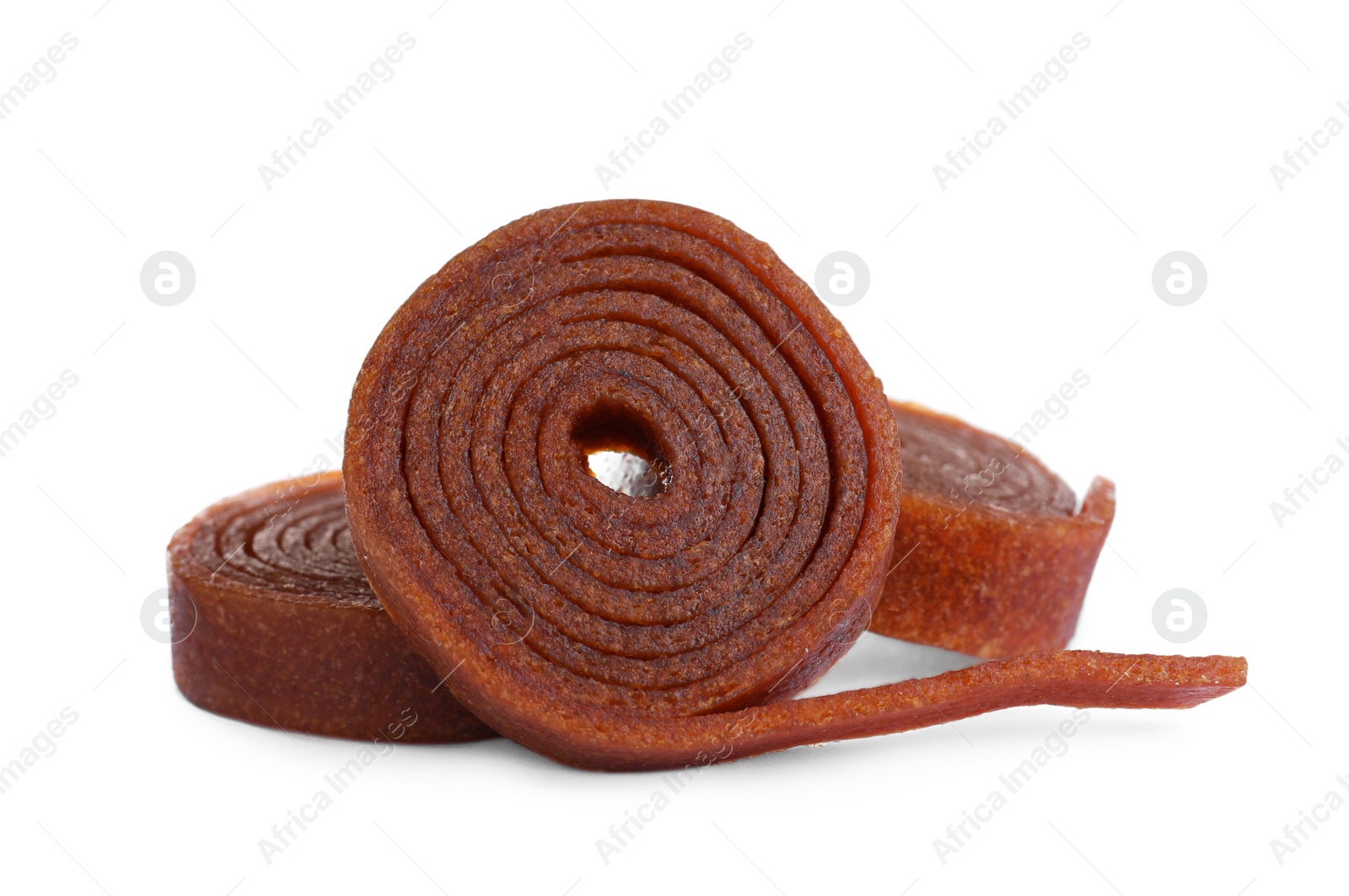 Photo of Delicious fruit leather rolls on white background