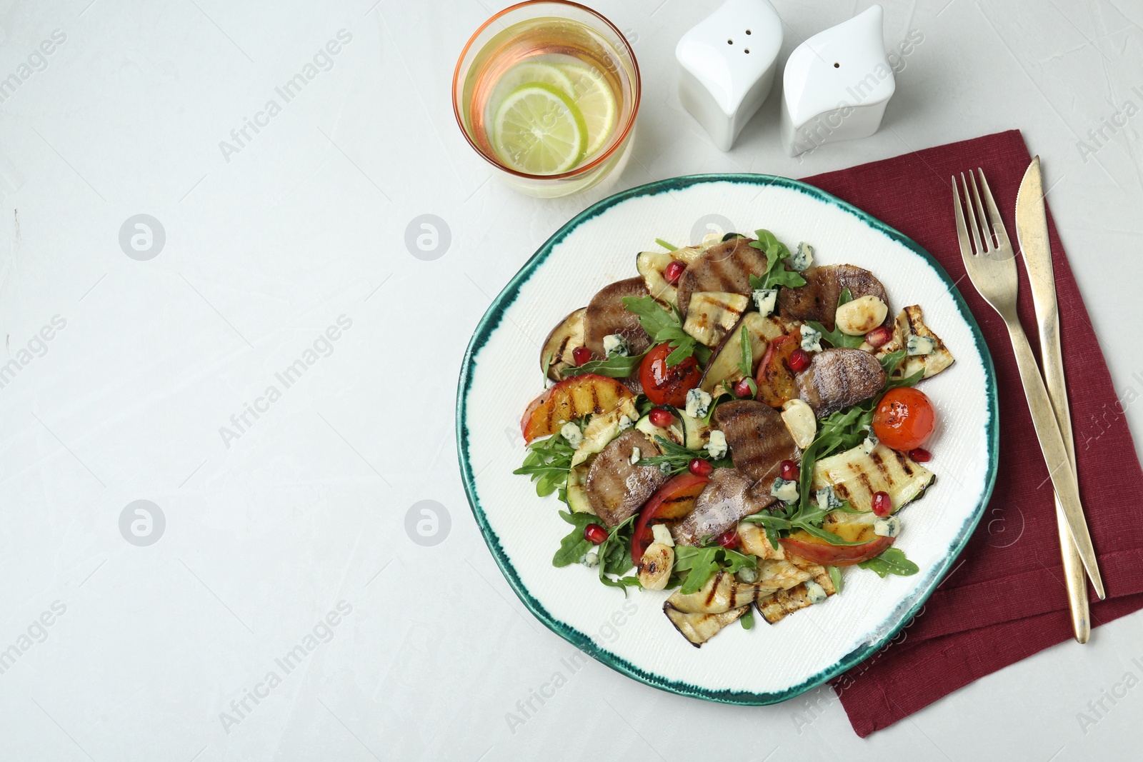 Photo of Delicious salad with beef tongue, grilled vegetables, peach and blue cheese on white table, flat lay. Space for text