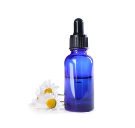 Photo of Bottle of chamomile essential oil and flowers isolated on white