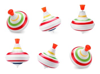 Colorful spinning tops isolated on white. Toy whirligig