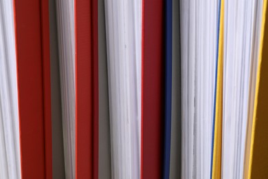 Colorful binder office folders as background, closeup