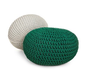 Photo of Different stylish knitted poufs on white background