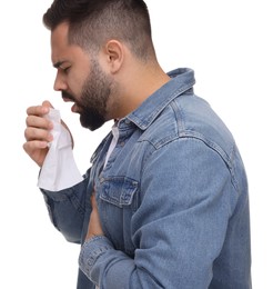 Sick man with tissue coughing on white background