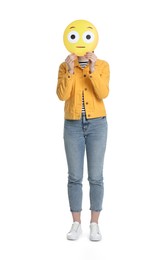 Photo of Woman covering face with surprised emoticon on white background