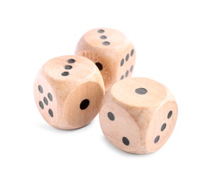 Photo of Three wooden game dices isolated on white
