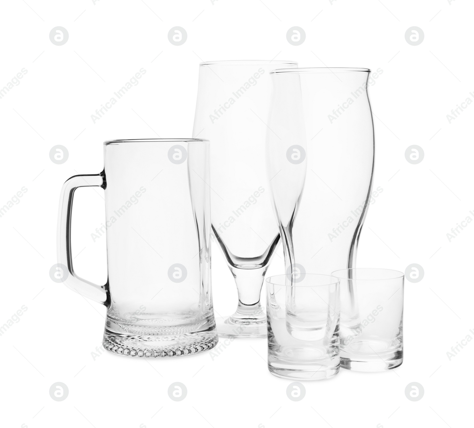 Photo of Different elegant empty glasses isolated on white