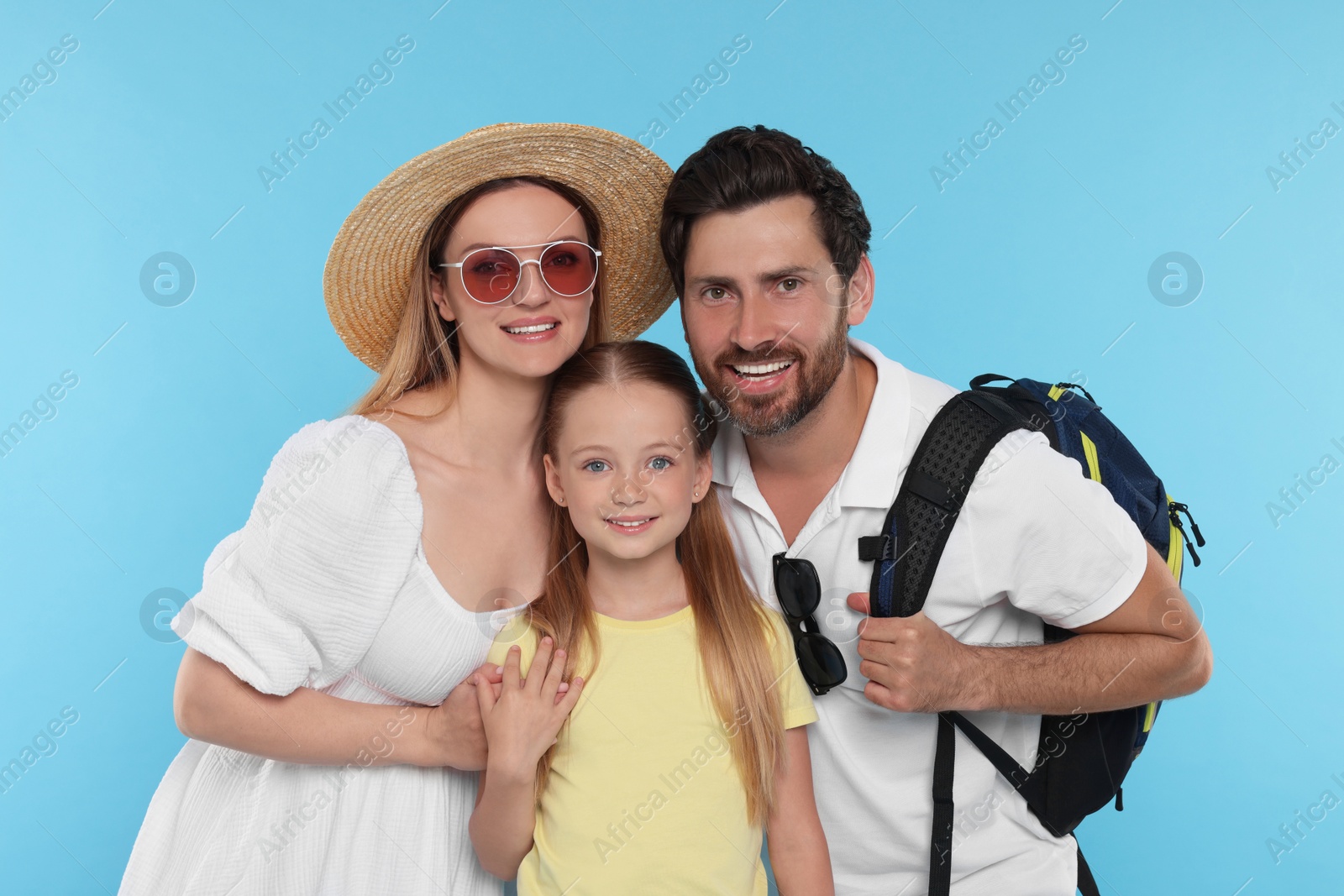 Photo of Happy family together on light blue background