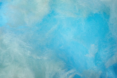 Sweet blue cotton candy as background, closeup view