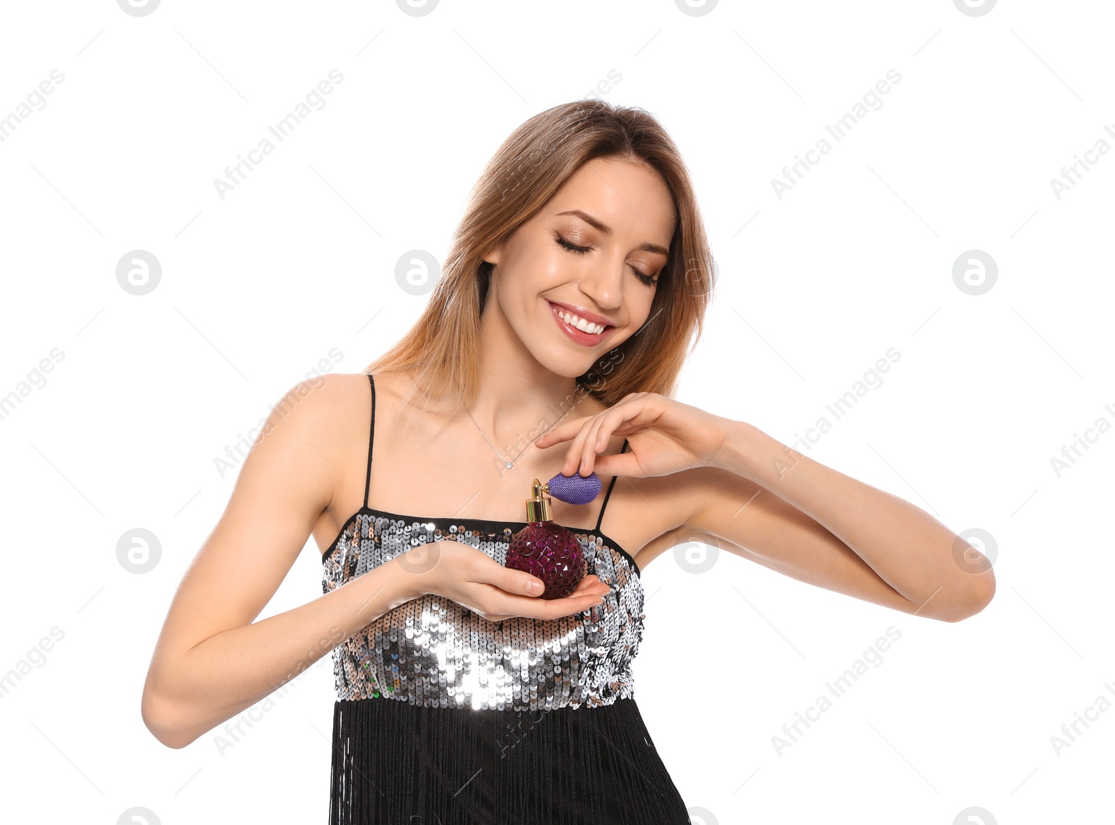 Photo of Young woman with bottle of perfume isolated on white