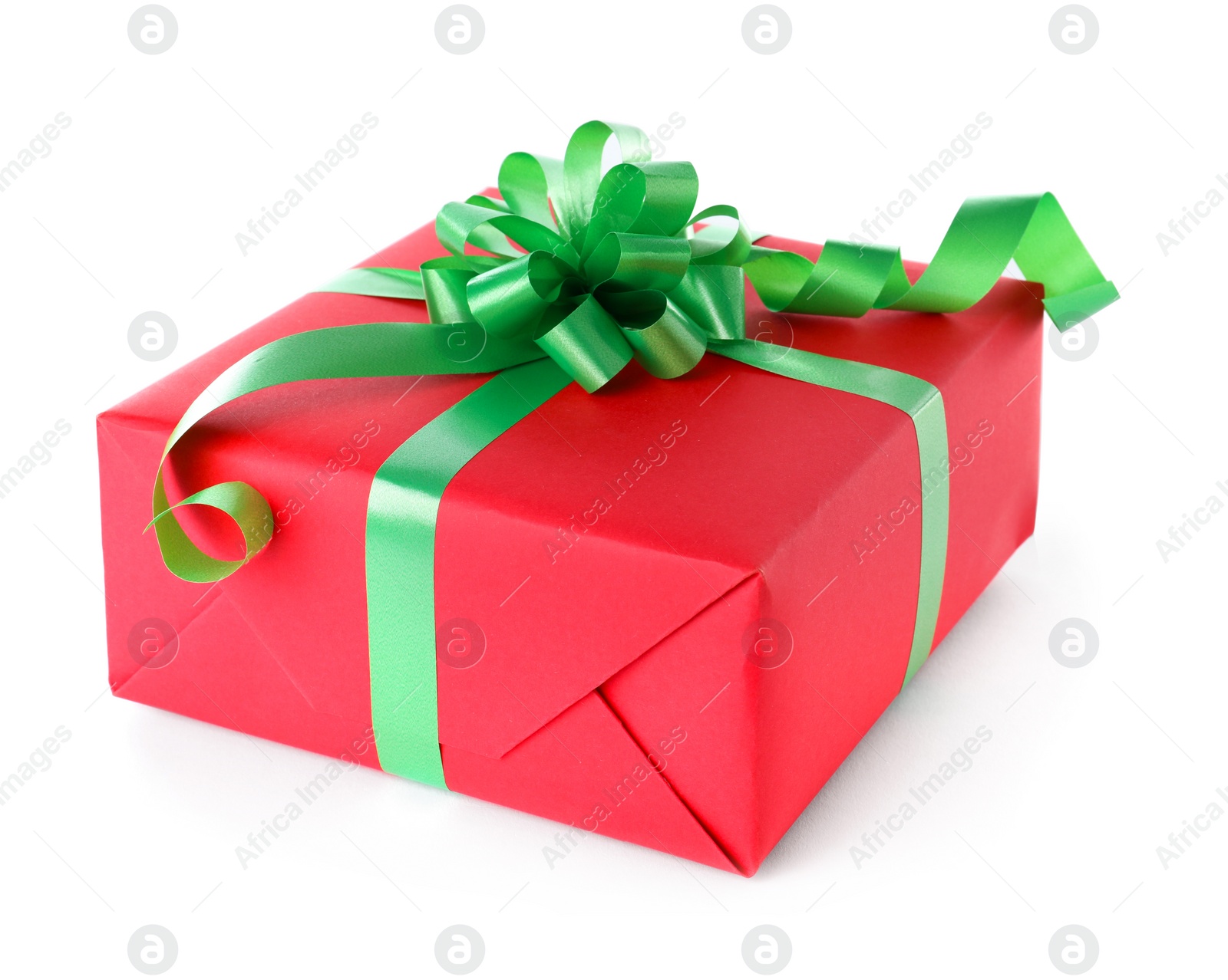 Photo of Christmas gift box decorated with ribbon bow on white background