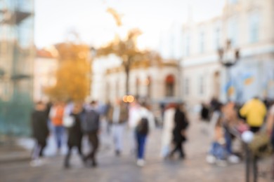 Blurred view of people walking on city street