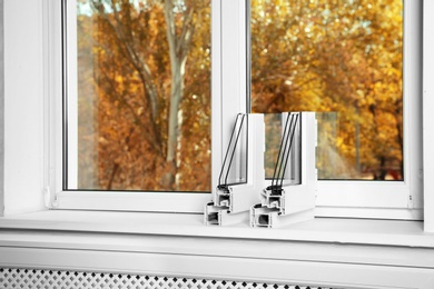 Samples of modern window profiles on sill indoors, space for text. Installation service