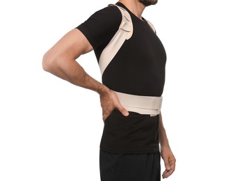 Photo of Closeup view of man with orthopedic corset on white background