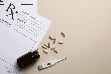 Photo of Medical prescription forms, pills and thermometer on beige background, flat lay. Space for text