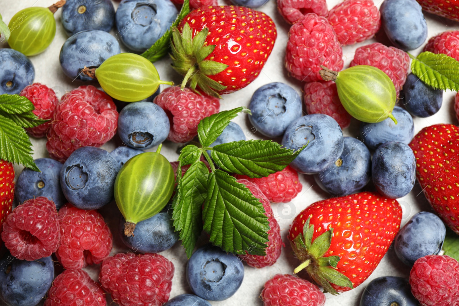 Photo of Mix of fresh berries on white background, flat lay